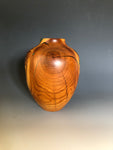 WT #188, Hollow Form Vessel from Peach with Malachite and Jet inlay.