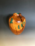 WT #188, Hollow Form Vessel from Peach with Malachite and Jet inlay.