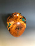 WT #188, Hollow Form Vessel from Peach with Malachite and Jet inlay.