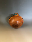 WT #204, Hollow Form Vessel from Peach with Jet and Turquoise inlay.