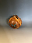 WT #204, Hollow Form Vessel from Peach with Jet and Turquoise inlay.