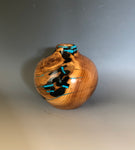 WT #204, Hollow Form Vessel from Peach with Jet and Turquoise inlay.