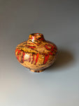 WT #292 Miniature Hollow Form Vessel from Jarrah Burl with Red Coral inlay.